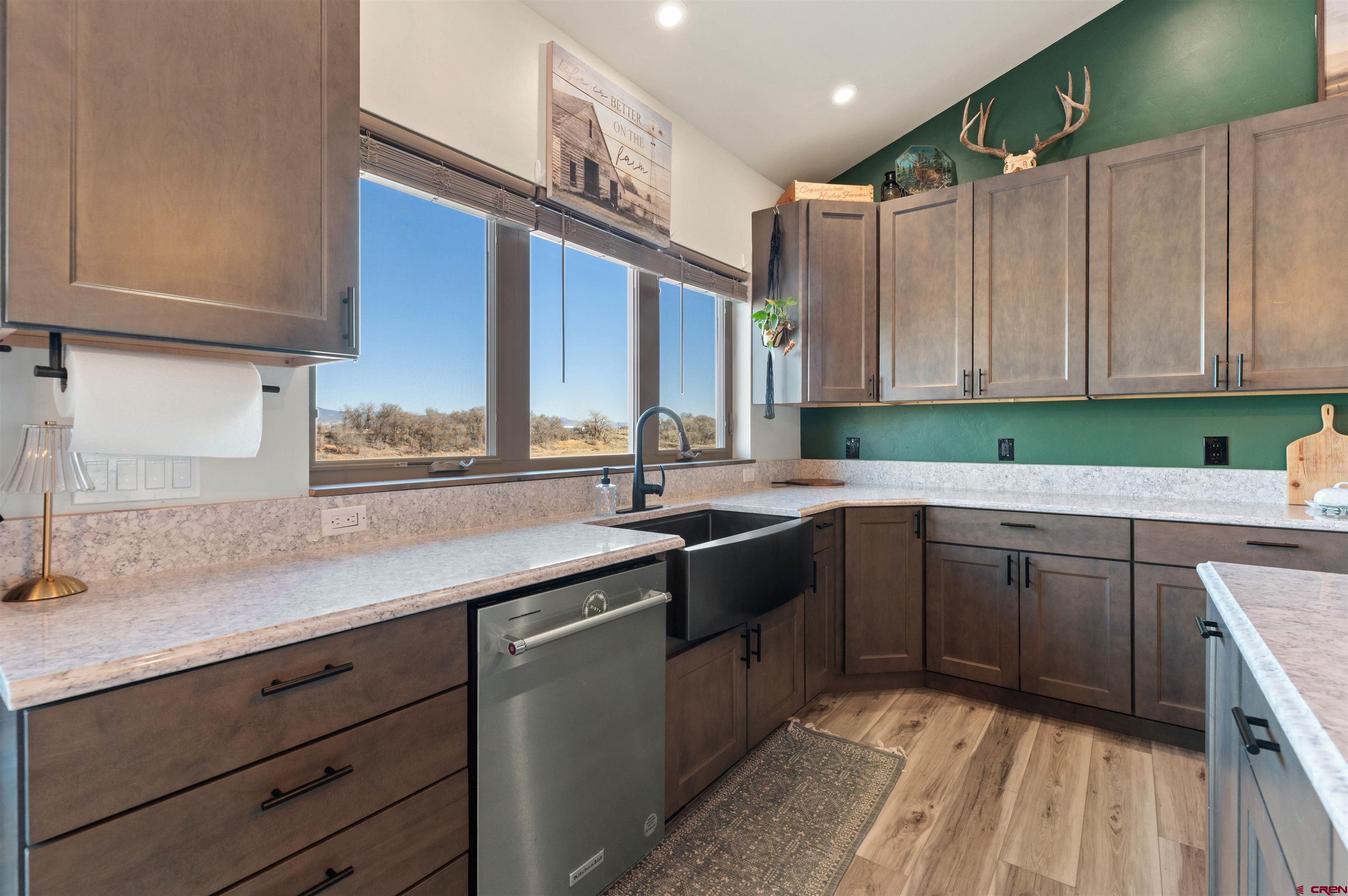 55347 Begonia Road Delta, CO 81416 - Photo 29 of 44 a kitchen with a sink cabinets and window