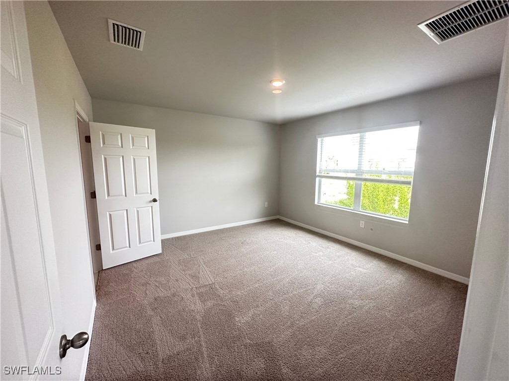 801 Serenity Lane LaBelle, FL 33935 - Photo 11 of 12 an empty room with windows