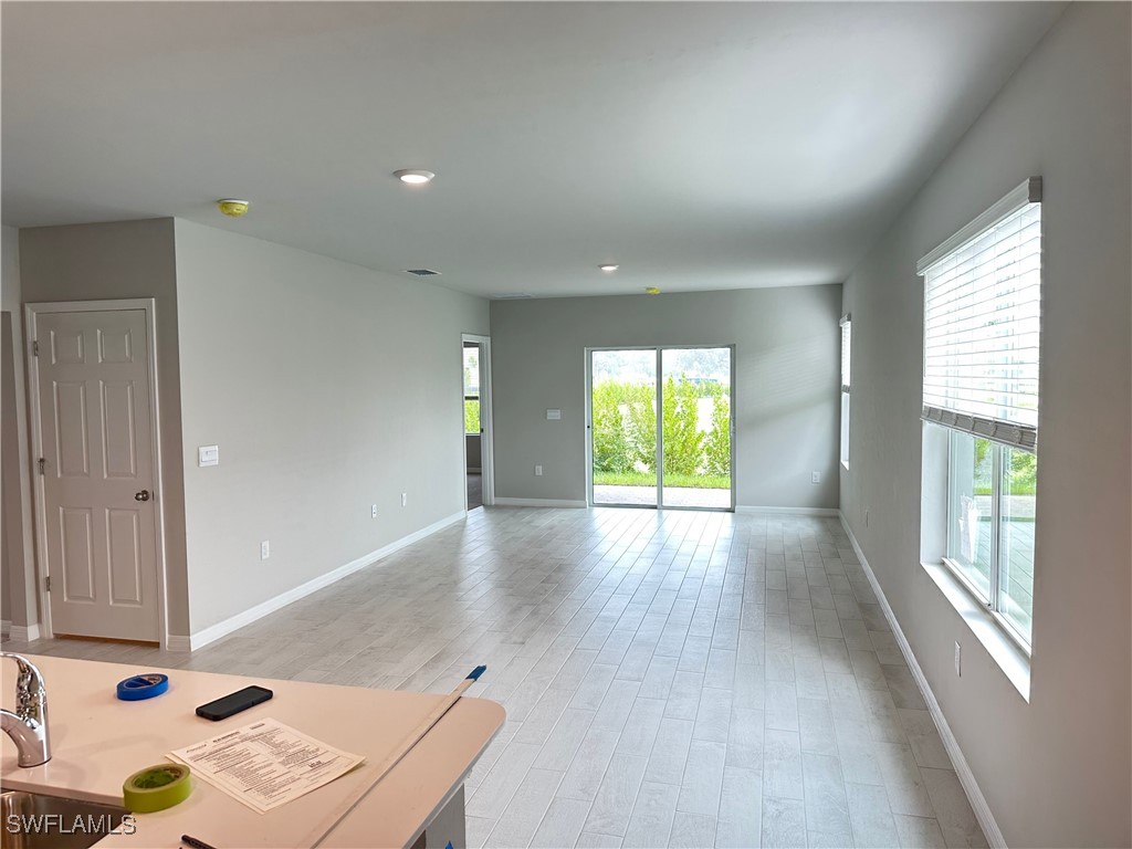 801 Serenity Lane LaBelle, FL 33935 - Photo 5 of 12 a view of workspace with wooden floor and windows