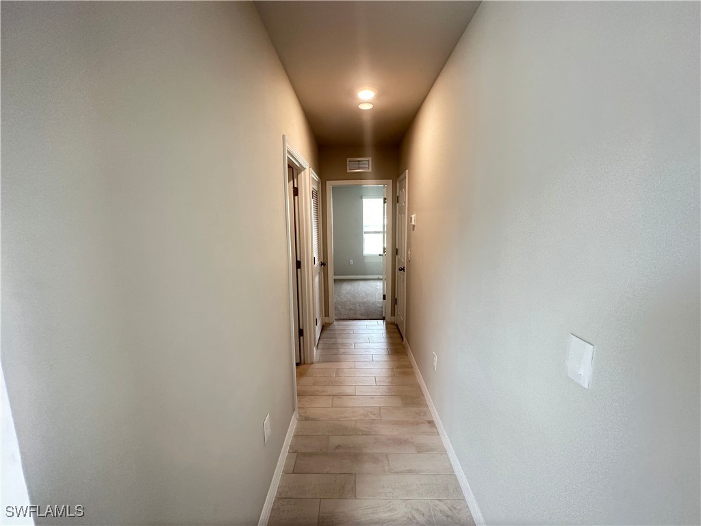 801 Serenity Lane LaBelle, FL 33935 - Photo 6 of 12 a view of a hallway