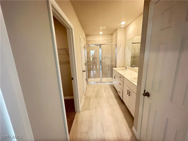 a view of a bathroom from a hallway