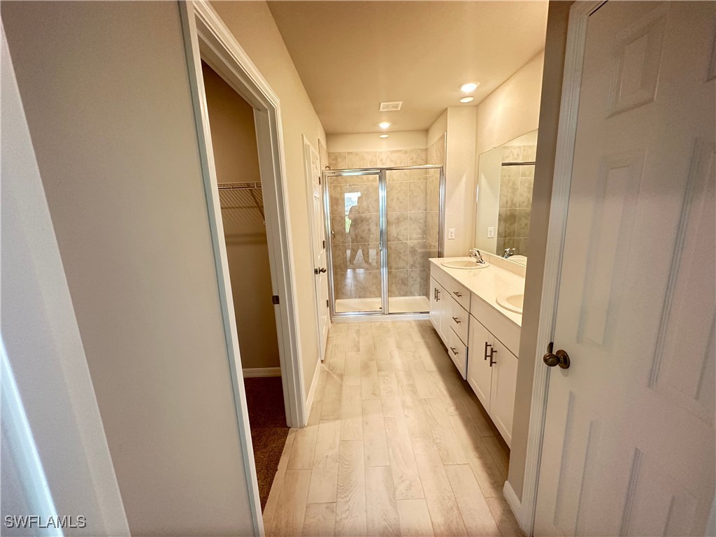 801 Serenity Lane LaBelle, FL 33935 - Photo 7 of 12 a view of a bathroom from a hallway