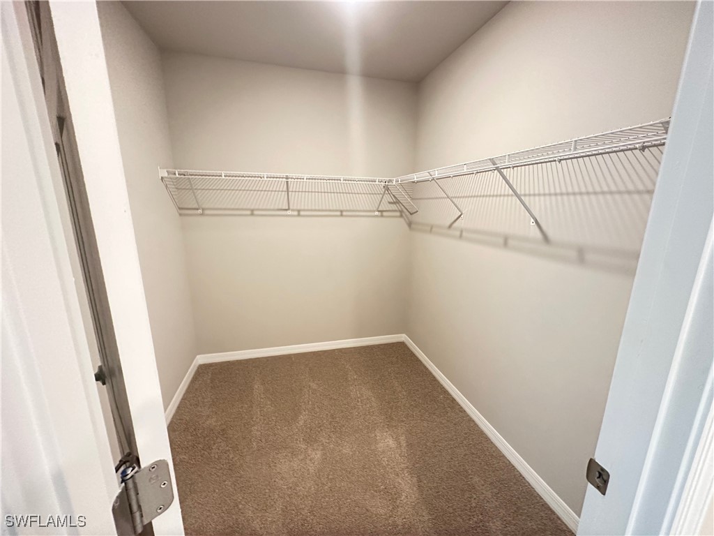 801 Serenity Lane LaBelle, FL 33935 - Photo 9 of 12 a view of a room with racks on the wall