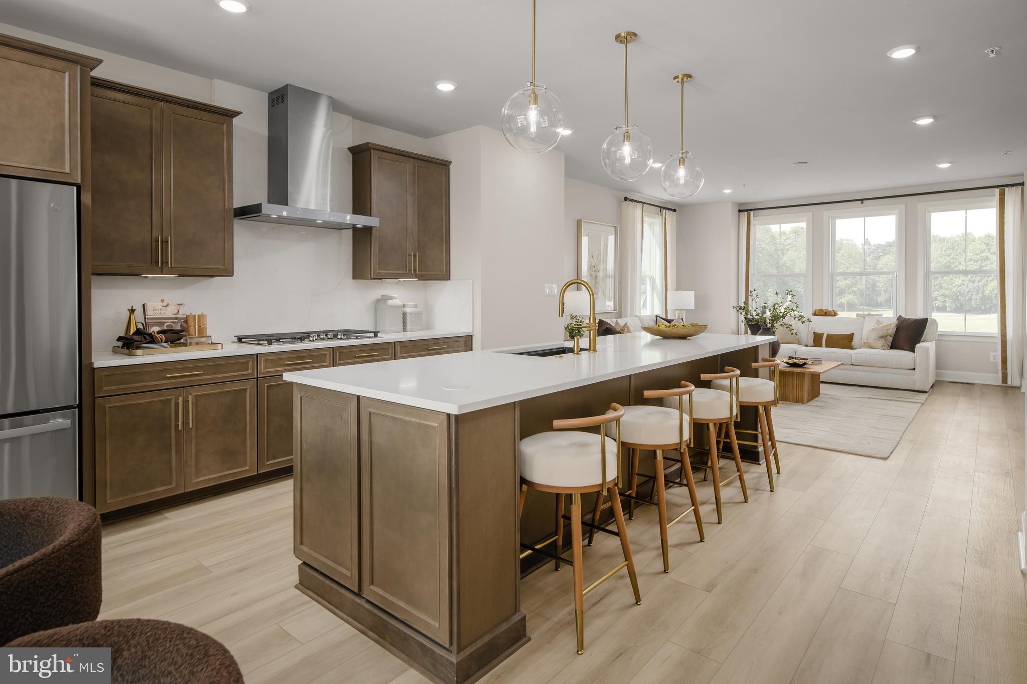 9321 Founders Lane Perry Hall, MD 21128 - Photo 4 of 22 a kitchen with sink cabinets and wooden floor