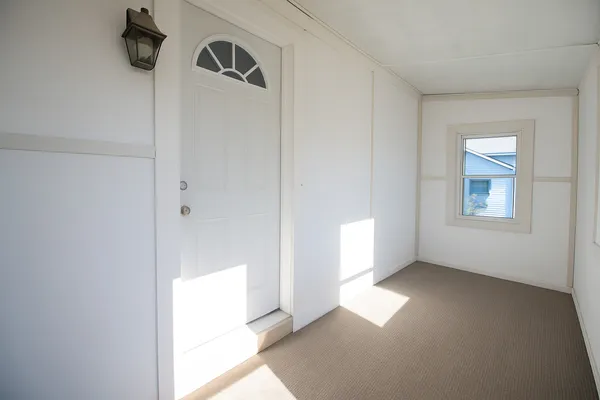 a view of empty room with windows