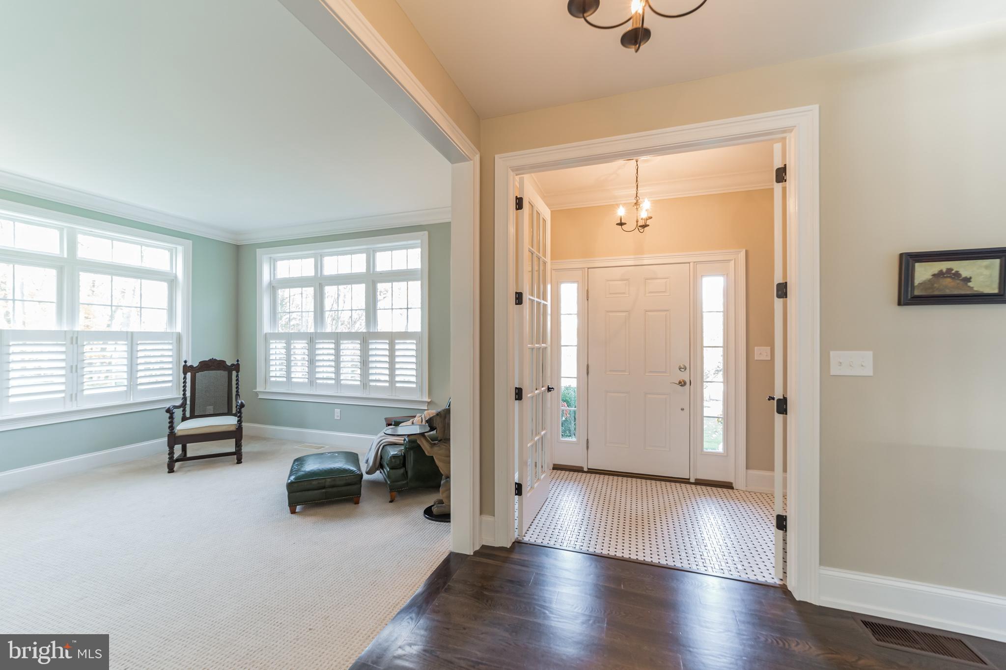 Entrance Vestibule.  Tall interior Door and Window