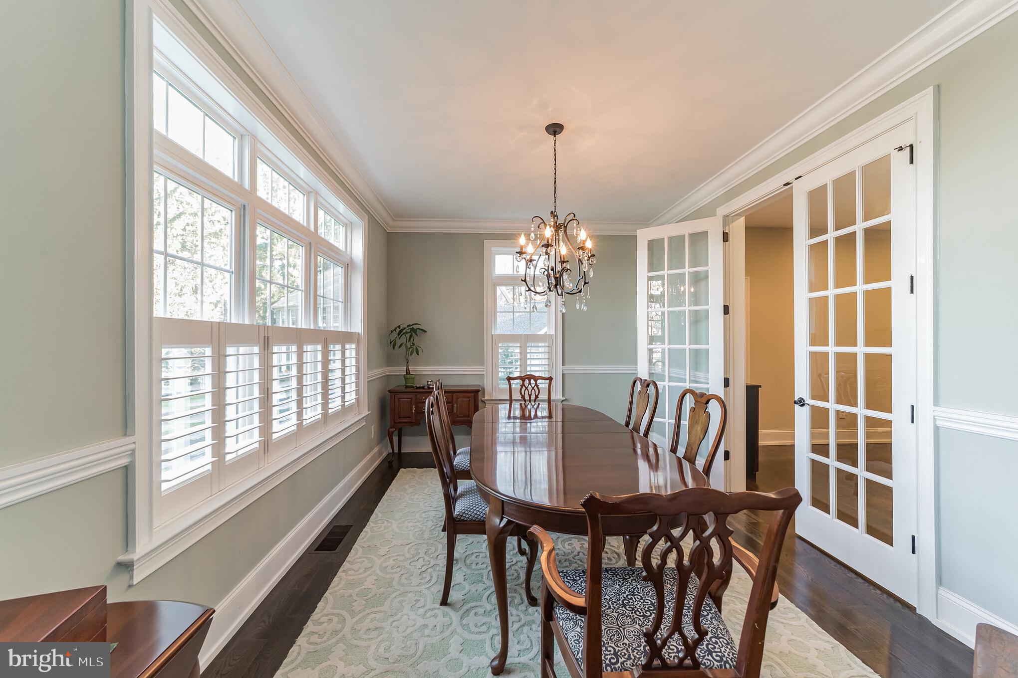 Dining Room with Tall Glass Doors and Windows