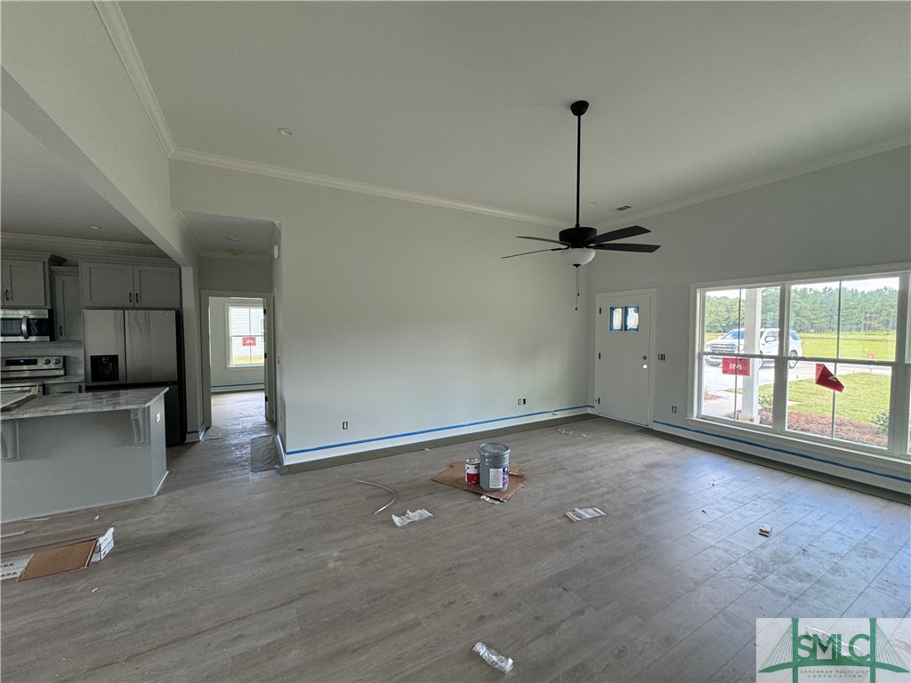 86 Owens Road Pembroke, GA 31321 - Photo 9 of 32 Great room has ceiling fan, crown, triple windows,