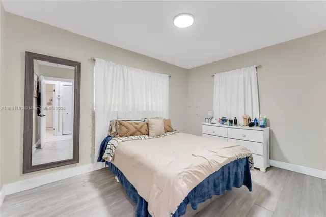 a bedroom with a bed and cabinets