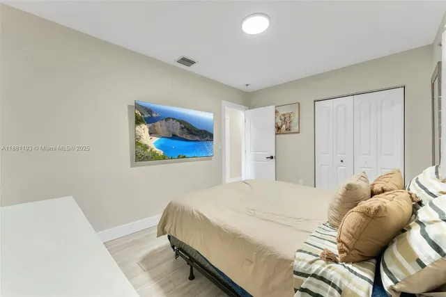 a bedroom with a bed and a closet