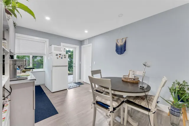 a bedroom with a bed a couch and dresser