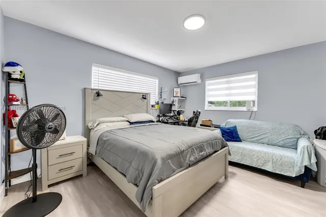 a bedroom with a bed and a view