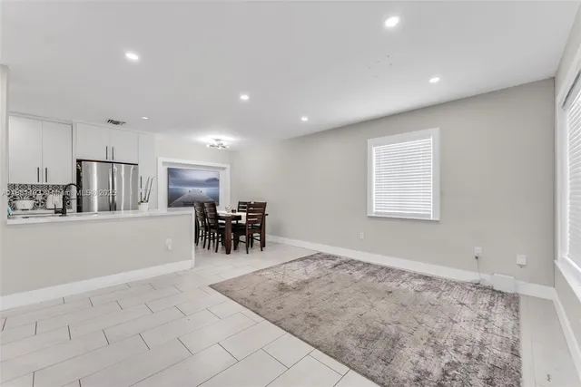 a view of a room with furniture and chandelier