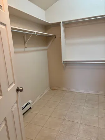 a view of an empty walk in closet