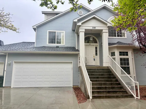 a front view of a house with a garage