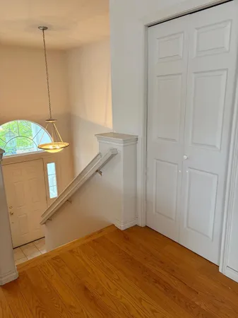 a view of kitchen with stainless steel appliances wooden floor