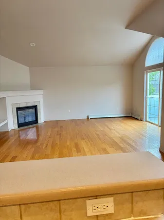 a view of kitchen and kitchen with microwave