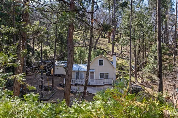 a view of a backyard of the house