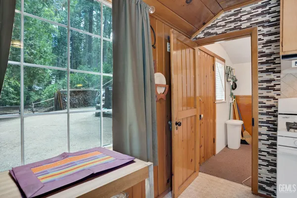 a view of balcony with wooden floor and fence
