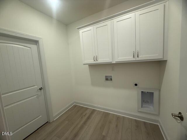 25 Slippery Elm Road Youngsville, NC 27596 - Photo 19 of 36 a view of cabinets and wooden floor
