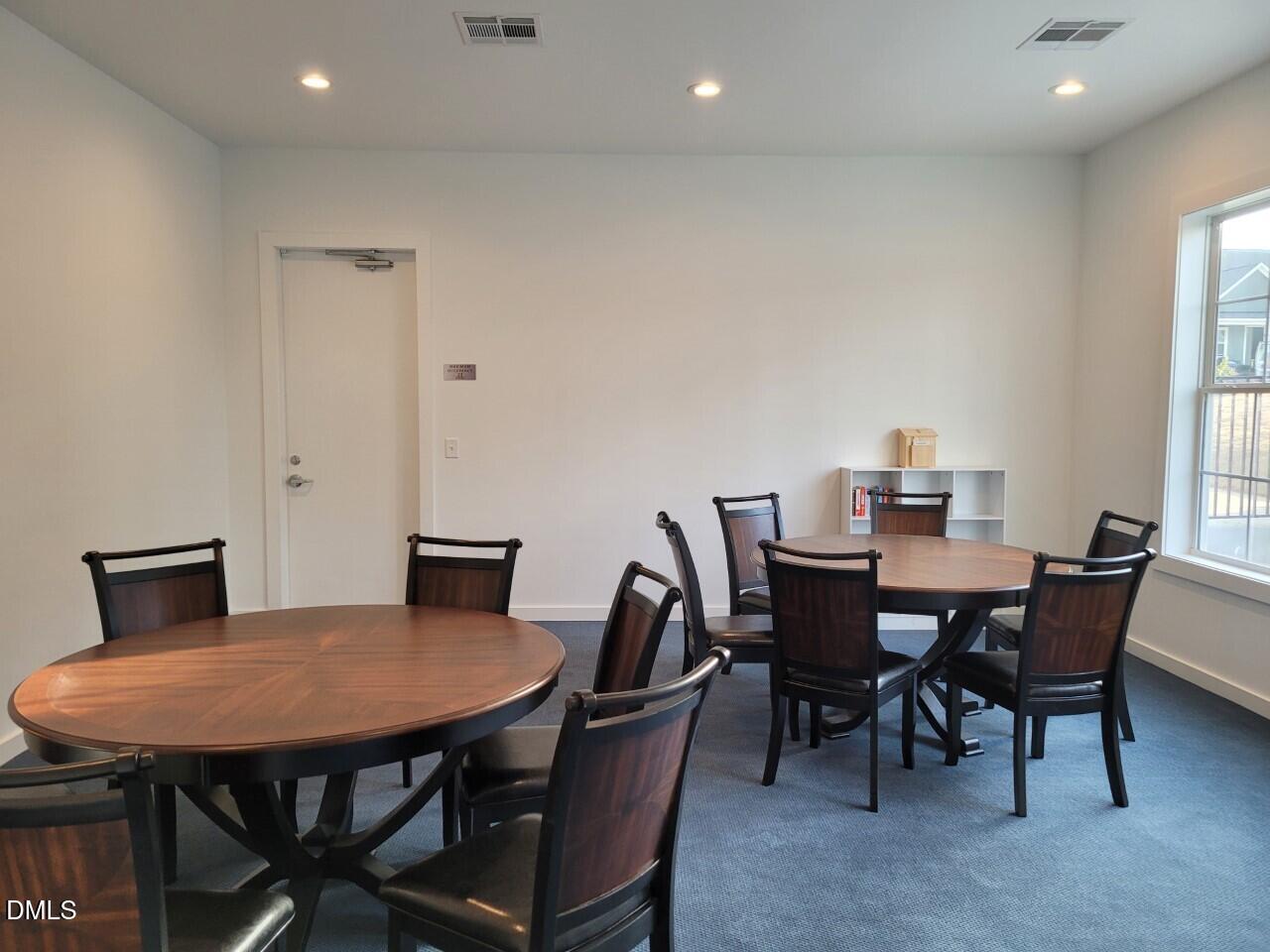 25 Slippery Elm Road Youngsville, NC 27596 - Photo 31 of 36 a view of a dining room with furniture
