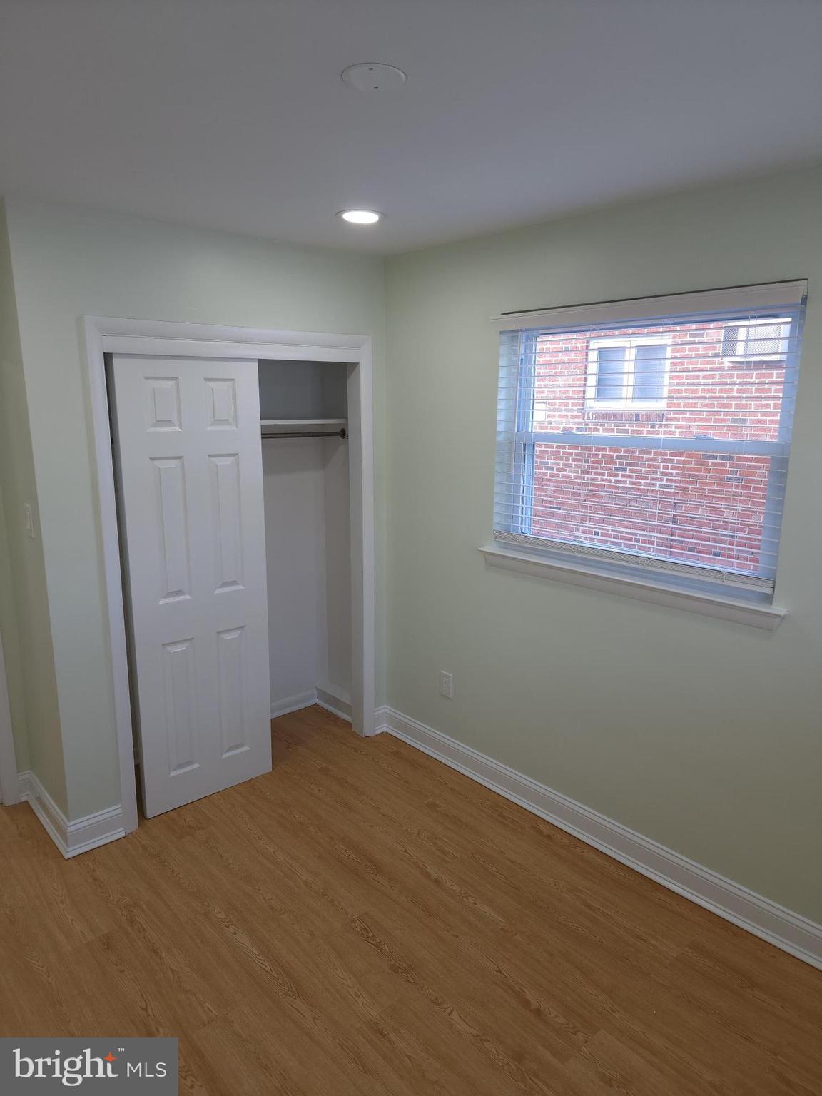 8303 Ridgeway Street Philadelphia, PA 19111 - Photo 15 of 24 an empty room with wooden floor and windows