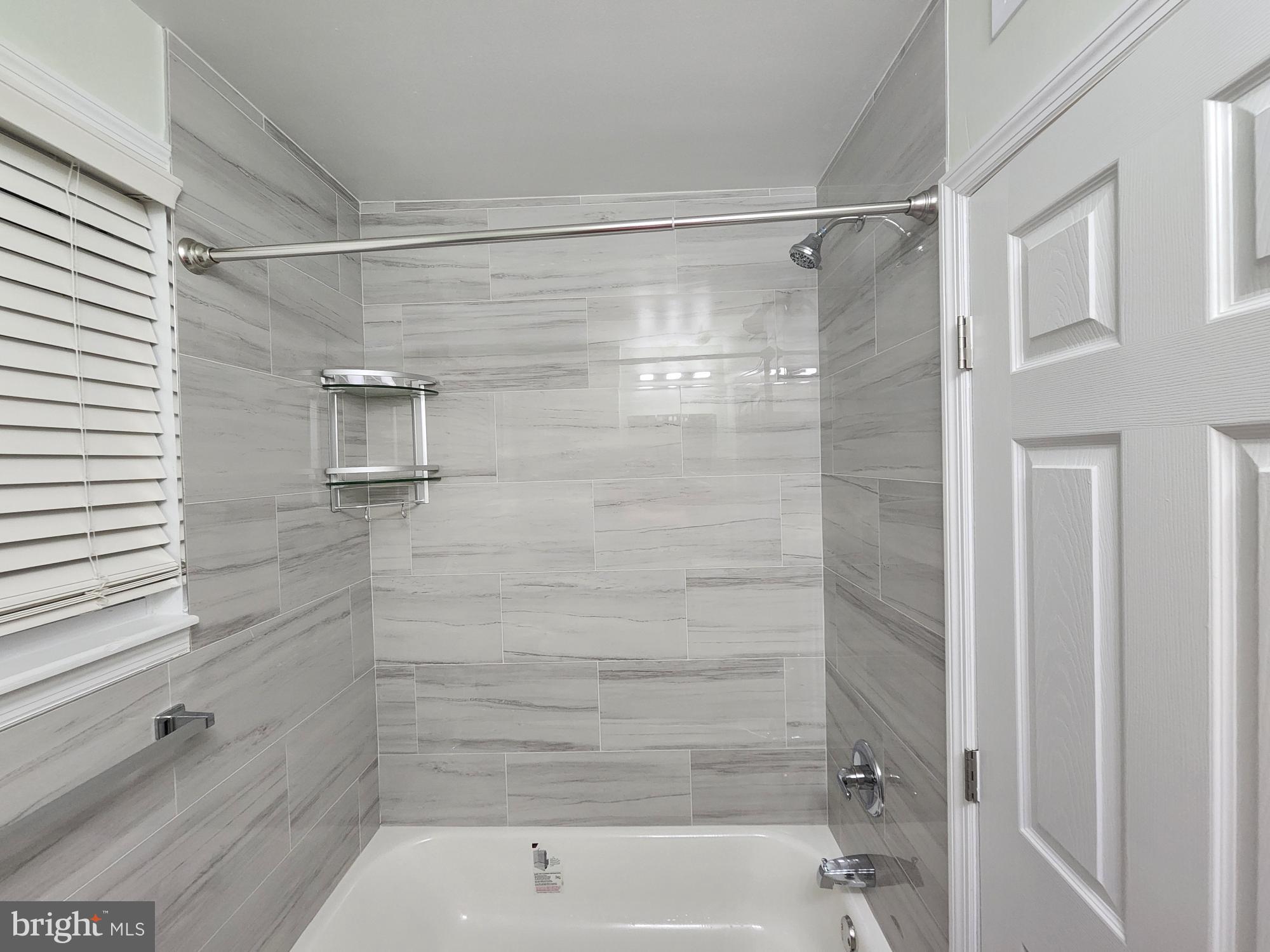 8303 Ridgeway Street Philadelphia, PA 19111 - Photo 17 of 24 a bathroom with a shower