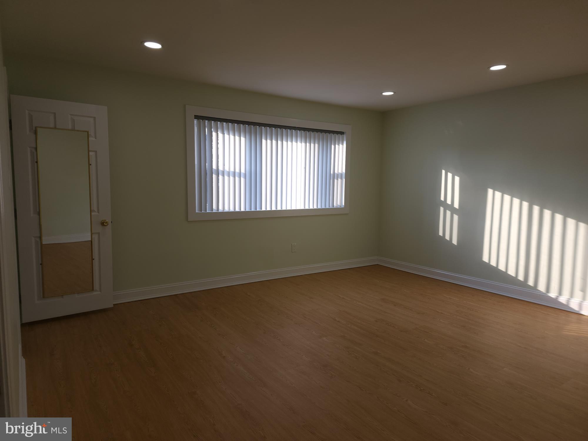 8303 Ridgeway Street Philadelphia, PA 19111 - Photo 2 of 24 an empty room with windows