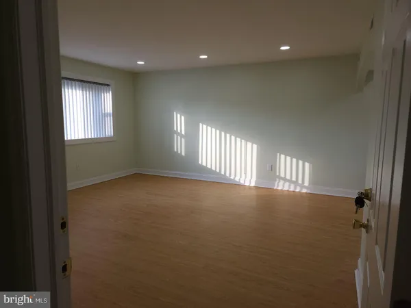 a view of empty room with windows