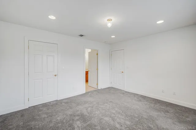 a bathroom with a toilet a sink and shower