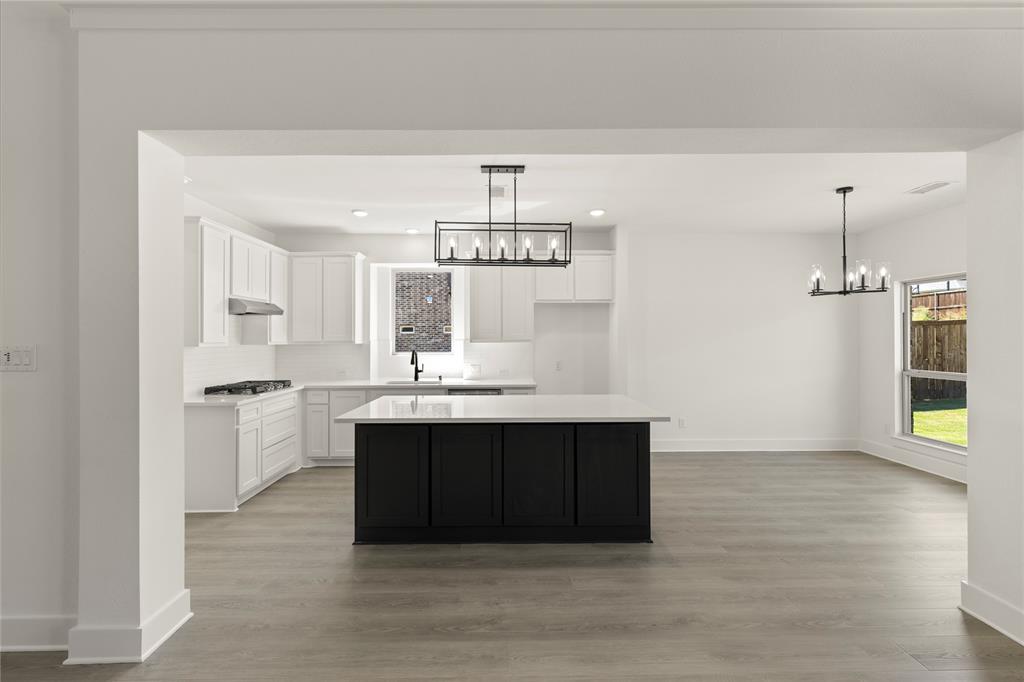 968 Gold Finch Lane Forney, TX 75126 - Photo 11 of 27 a spacious bathroom with a sink and a mirror