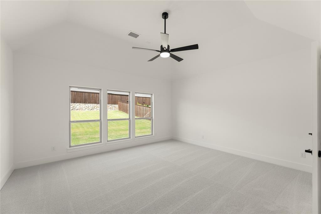 968 Gold Finch Lane Forney, TX 75126 - Photo 16 of 27 an empty room with windows and ceiling fan