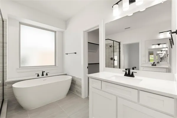 a bathroom with a double vanity sink mirror and double
