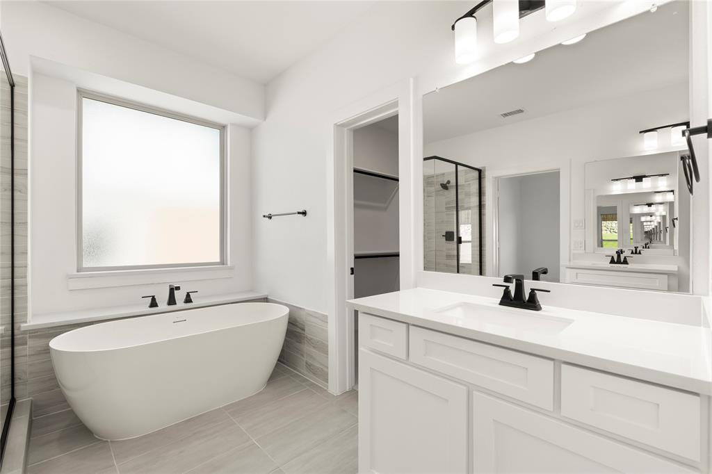 968 Gold Finch Lane Forney, TX 75126 - Photo 20 of 27 a bathroom with a double vanity sink mirror and double