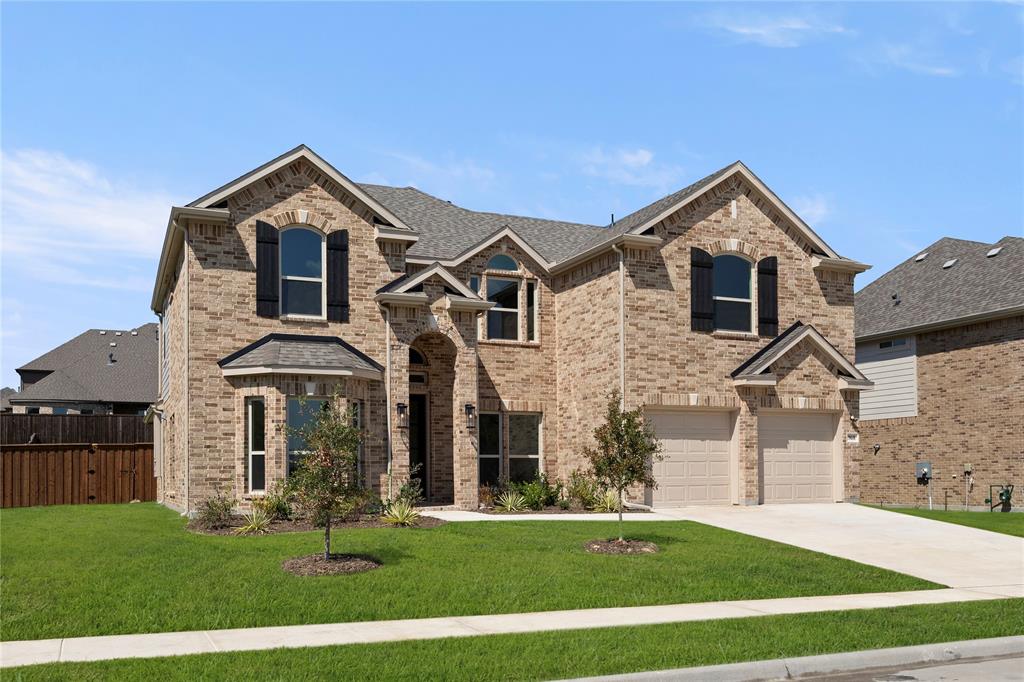968 Gold Finch Lane Forney, TX 75126 - Photo 2 of 27 a front view of a house with a yard