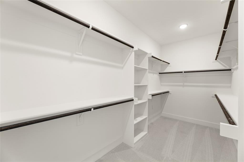 968 Gold Finch Lane Forney, TX 75126 - Photo 22 of 27 a view of walk in closet with empty racks