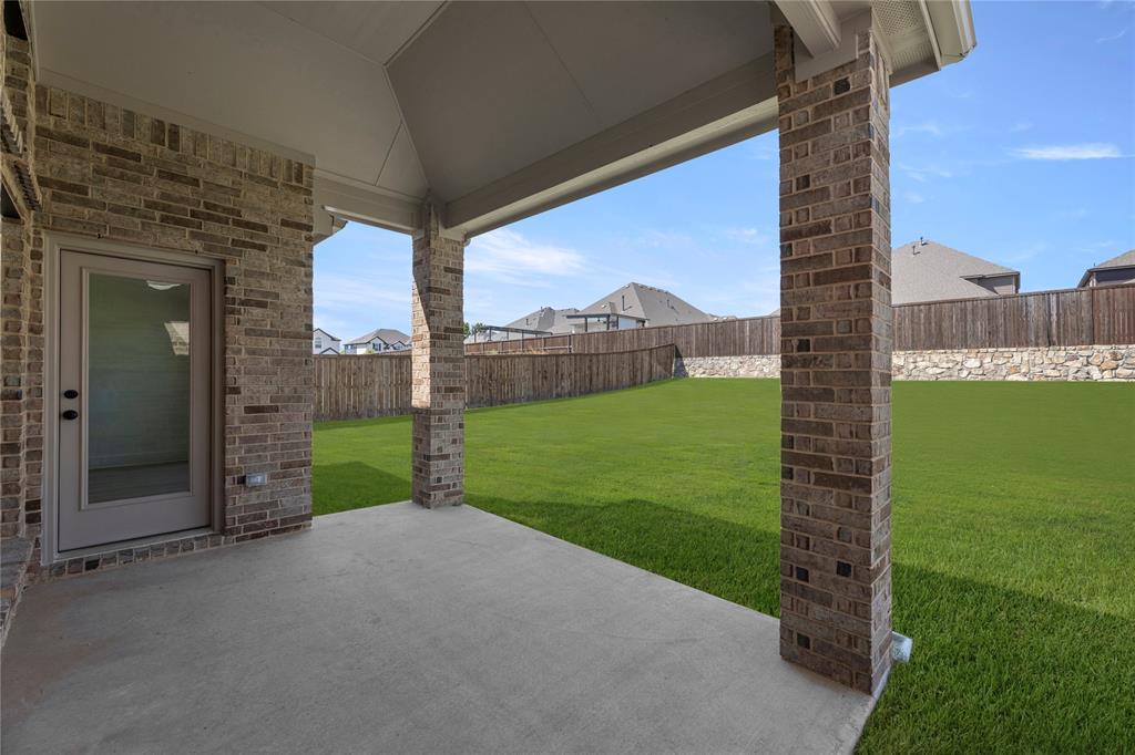 968 Gold Finch Lane Forney, TX 75126 - Photo 25 of 27 a view of a garden with a large tree