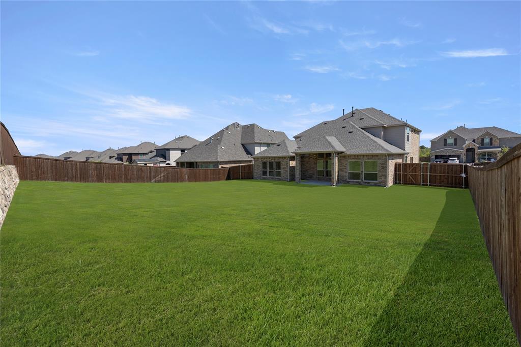968 Gold Finch Lane Forney, TX 75126 - Photo 26 of 27 a view of a house with a big yard
