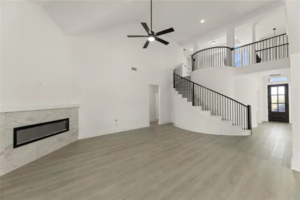 a view of an entryway with wooden floor