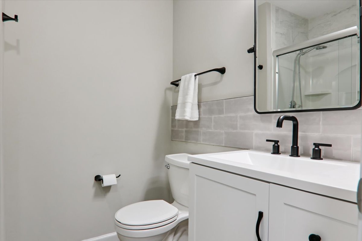 600 Carriage Hills Road, Unit A Normal, IL 61761 - Photo 12 of 19 a bathroom with a toilet sink and mirror