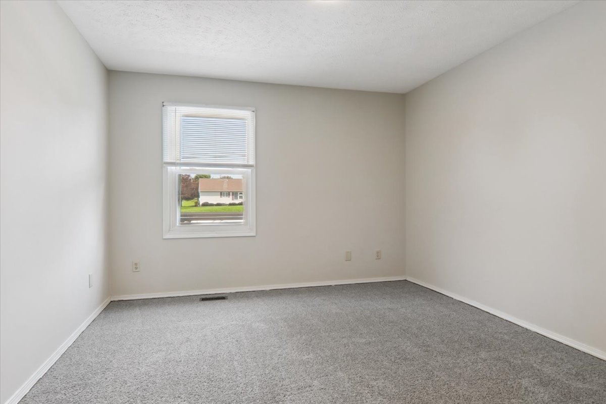 600 Carriage Hills Road, Unit A Normal, IL 61761 - Photo 14 of 19 an empty room with a window