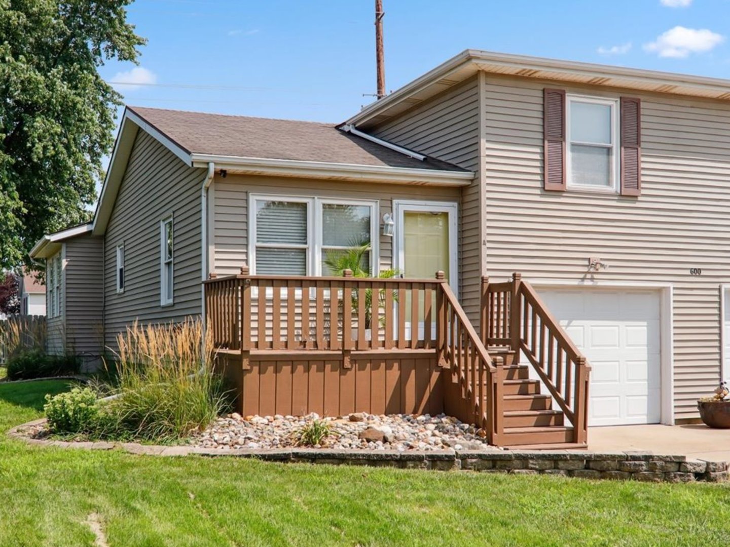 600 Carriage Hills Road, Unit A Normal, IL 61761 - Photo 19 of 19 a view of a house with a yard and deck