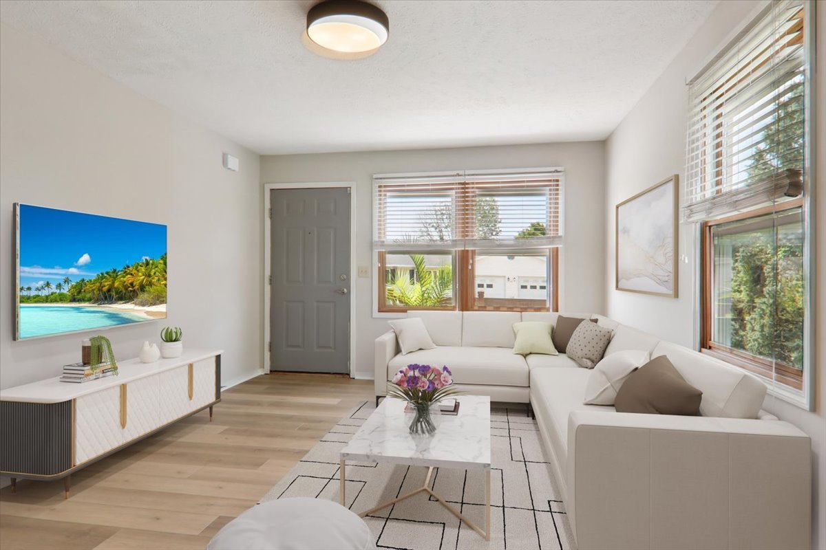600 Carriage Hills Road, Unit A Normal, IL 61761 - Photo 2 of 19 a living room with furniture and a flat screen tv