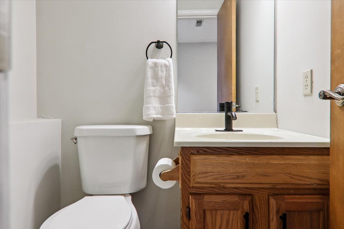 600 Carriage Hills Road, Unit A Normal, IL 61761 - Photo 9 of 19 a bathroom with a toilet sink and mirror