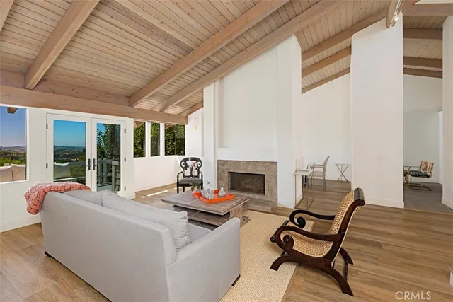 a outdoor living space with patio furniture and a fireplace