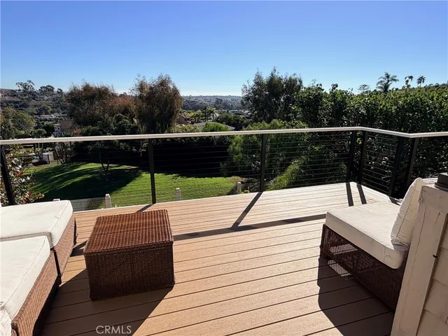 a view of a deck with wooden floor and outdoor space