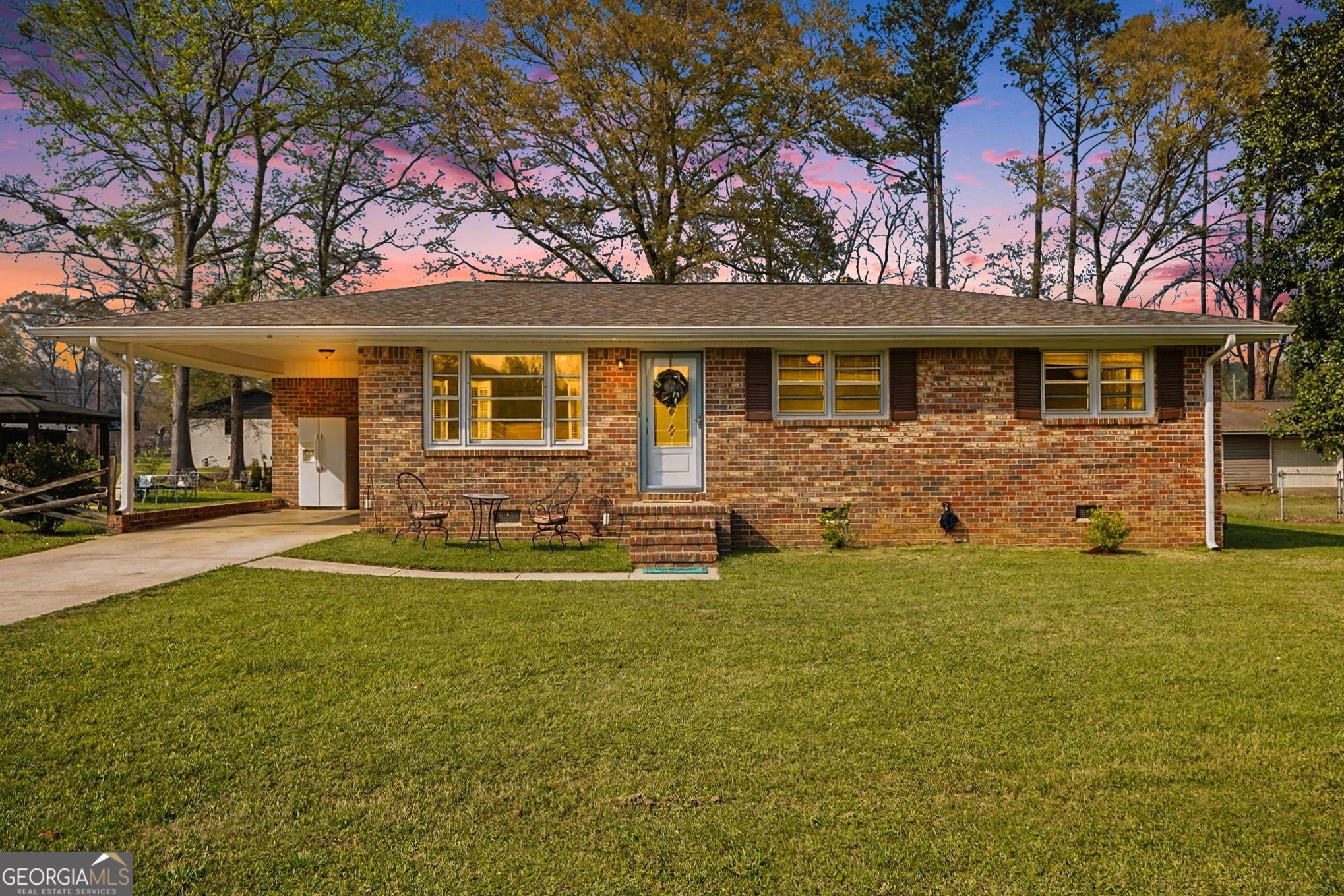 a front view of a house with yard
