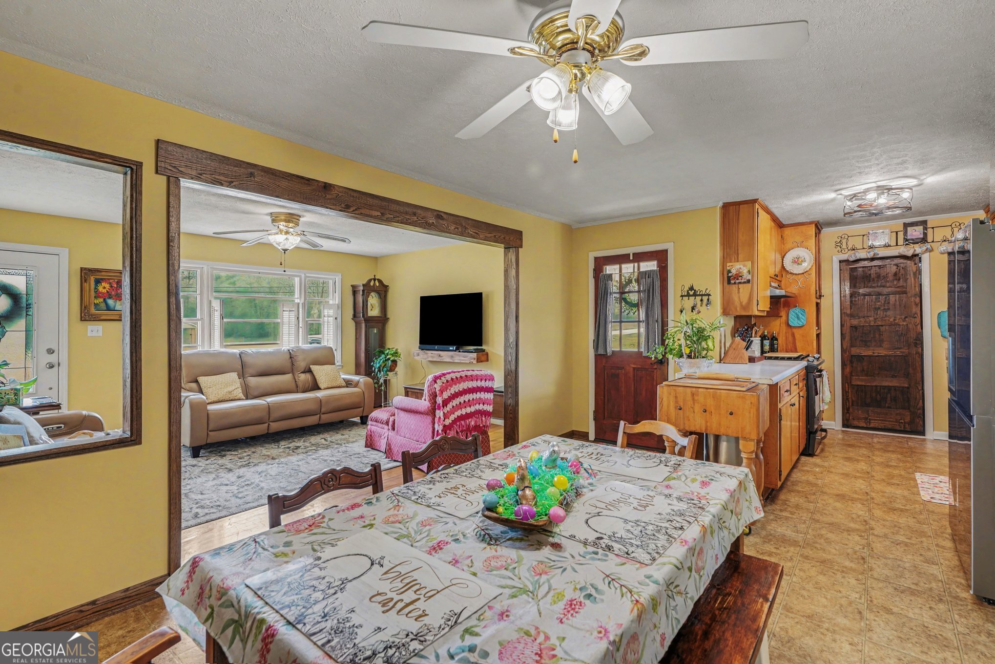 117 Dobbins Mill Road Griffin, GA 30223 - Photo 11 of 27 a living room with furniture and a flat screen tv