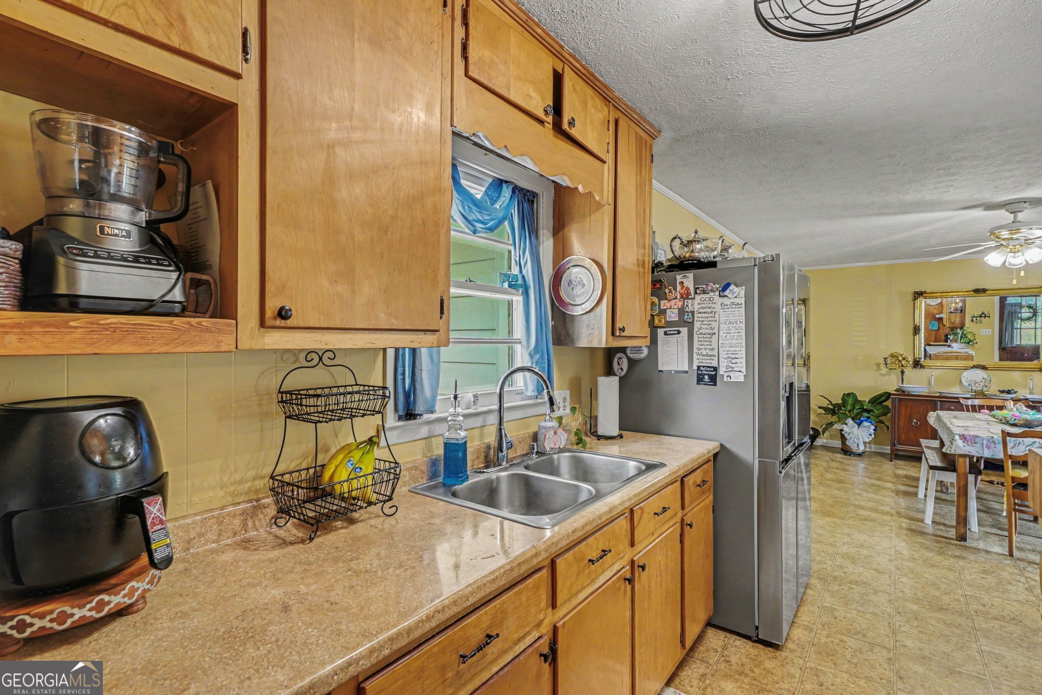 117 Dobbins Mill Road Griffin, GA 30223 - Photo 13 of 27 a kitchen with a sink and a stove top oven