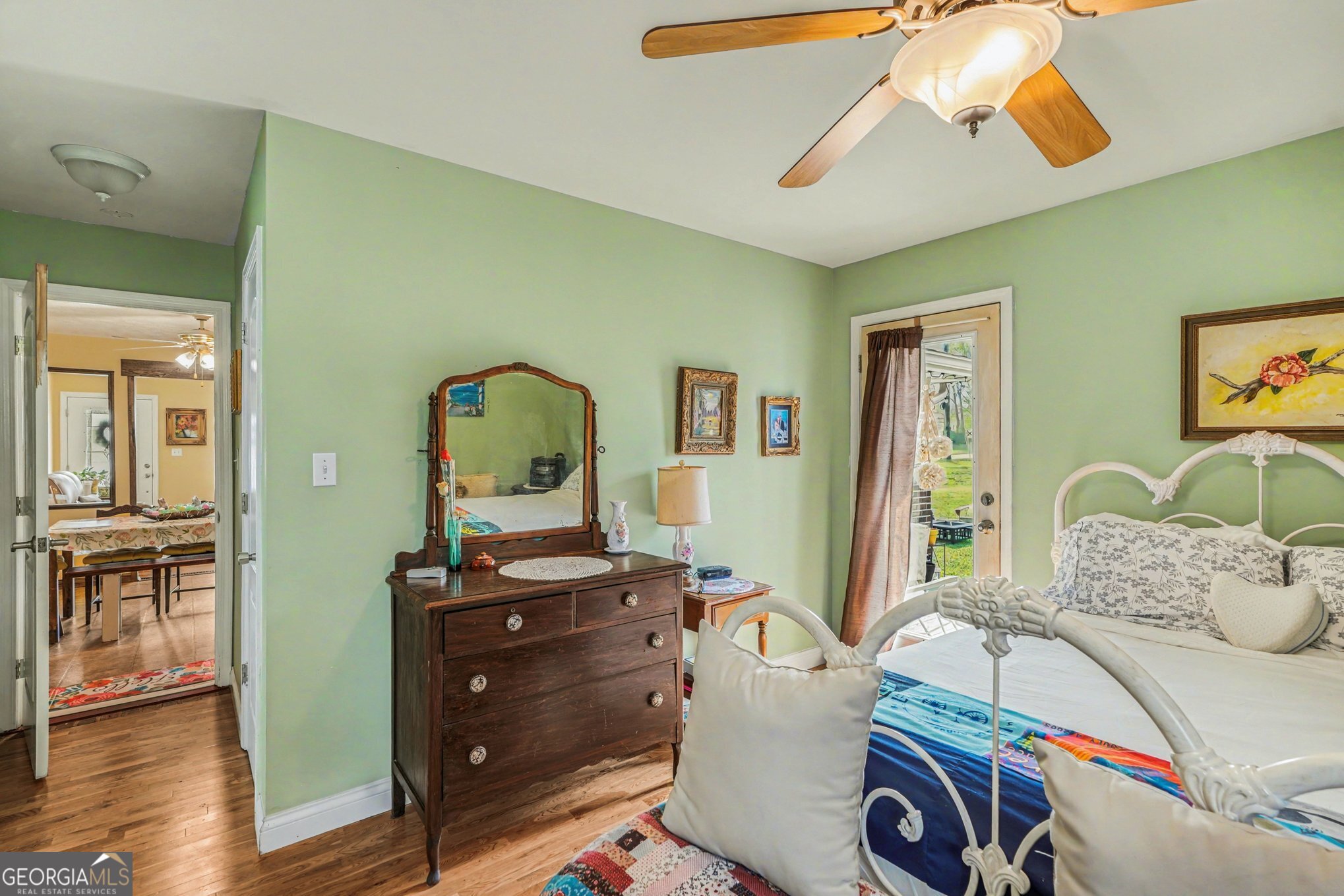 117 Dobbins Mill Road Griffin, GA 30223 - Photo 15 of 27 a bedroom with a bed and wooden floor